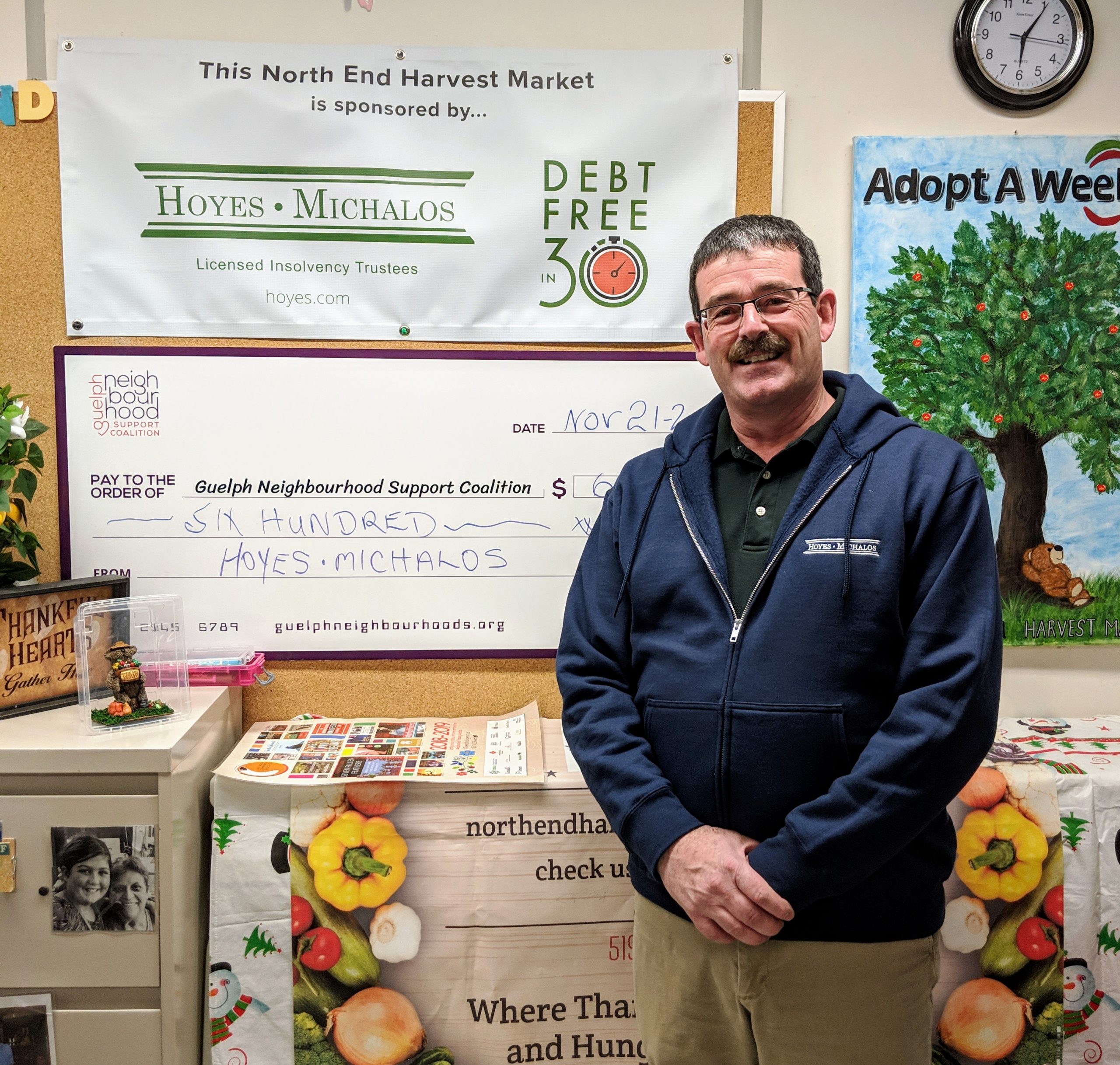 Ted Michalos with cheque to the North End Harvest Market